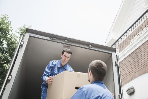 Professional movers loading furniture for a small removal job